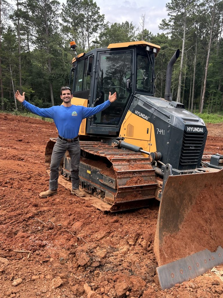 CASE excavator performing land clearing and grading in North Georgia by Samios Earth Solutions